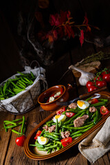 Obraz na płótnie Canvas Rustic green bean salad with egg and tuna