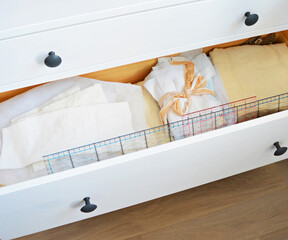Open chest drawer, quilting rulers and batting 