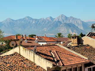 Old port city in the background of mountains