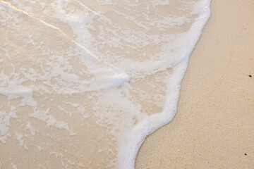 Sea wave on white sand beach
