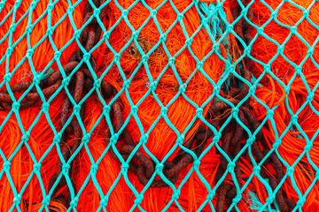 turquoise blue and orange fishing net