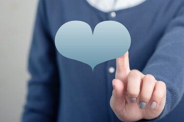 Cold heart blue clicks women's hands on Valentine's day