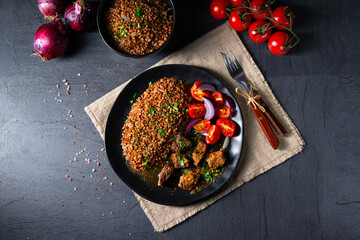 Buckwheat groats baked in the oven with beef goulash