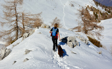 woman walking in winter mountains