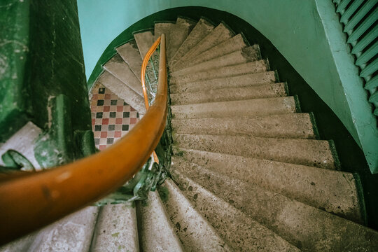 european Antique vintage rounded staircase in old house. Riga , Latvia. grainy vintage style image of a spiral staircase in an old house with iron railings - Powered by Adobe