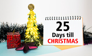 Christmas tree decorated with toys and tinsel, gift boxes and Notepad with text 25 days till...