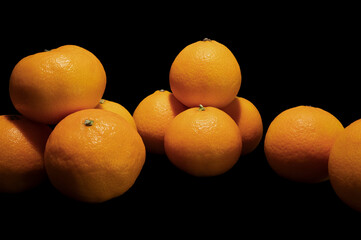 Tangerines on a black background