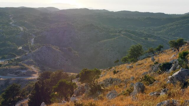 Sunset seen from Pantocrator mountain. Beautiful landscape of Corfu Mountains, Greece.