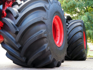 large Wheels with wide tires for large wheeled tractors. Agricultural machinery for working in the...