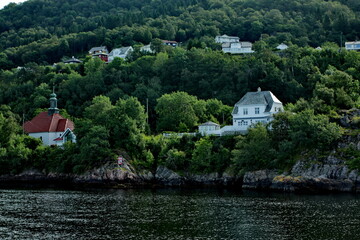 Scenic view of cottages in the woods on the shores of Osterfjord near Bergen, Norway