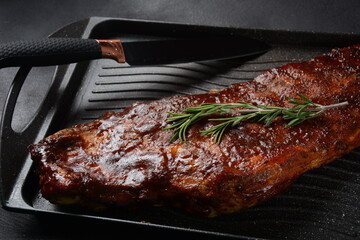 Closeup of pork ribs grilled with BBQ sauce and caramelized in honey