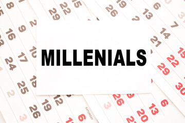 text MILLENIALS on a sheet from Notepad.a digital background. business concept . business and Finance.