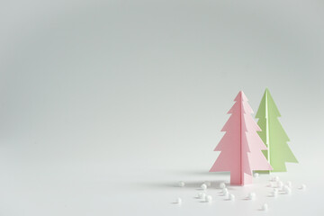 Paper cut in the shape of Christmas tree on white background.