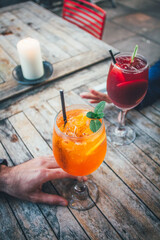 Detail of couple having a cocktail in a bar. Celebration date. 