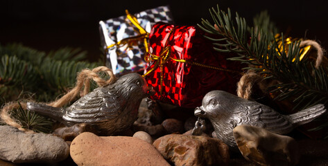 Naklejka premium Christmas accessories. Birds, boxes, branches of a Christmas tree