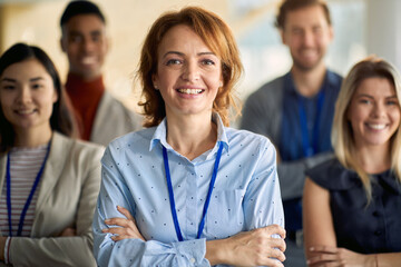 Group of job candidates posing for a photo at company hallway. People, job, company, business...