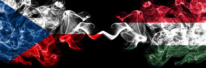 Czech Republic, Czech vs Hungary, Hungarian smoky mystic flags placed side by side. Thick colored silky abstract smoke flags.