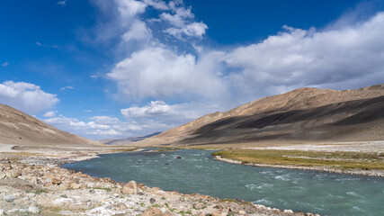 Fototapeta na wymiar View of the Pamir river in the high desert between Langar and Khargush pass in Gorno-Badakshan, the Pamir mountain region of Tajikistan bordering Afghanistan