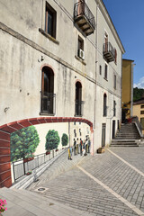 A narrow street among the old houses of Viggianello, a medieval village in the Basilicata region.