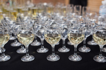 Close up of glasses of champagne on the table with shallow depth of field