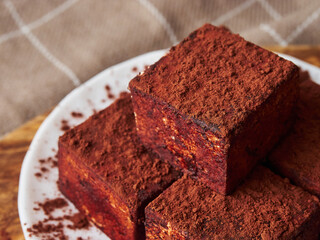 Pyramid square handmade souffle candy in chocolate close up