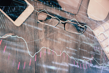 Multi exposure of forex graph hologram over desktop with phone. Top view. Mobile trade platform concept.