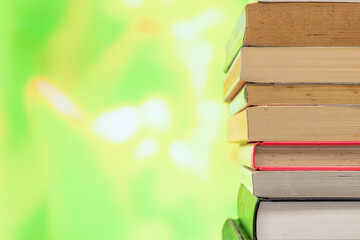 A pile of books with blurred colourful background for copy space