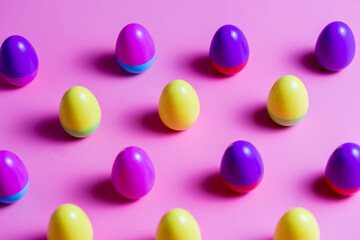 Colorful Plastic Easter Eggs on pink background