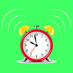 alarm clock on green background