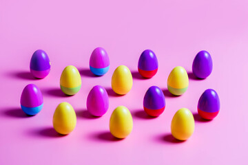 Colorful Plastic Easter Eggs on pink background