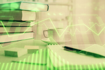Fototapeta premium Double exposure of financial chart drawing and desktop with coffee and items on table background. Concept of forex market trading