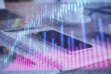 Double exposure of forex chart drawing and cell phone background. Concept of financial data analysis