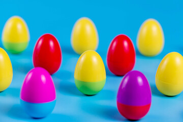Colorful Plastic Easter Eggs on blue background