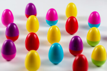 Colorful Plastic Easter Eggs on white background