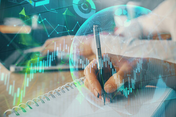 Double exposure of forex chart drawing over people taking notes background. Concept of financial...