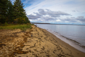  Remote empty beach on a sunny summer day on the coast of Lake Superior on the Whitefish Bay Scenic Byway in the Upper Peninsula of Michigan. 