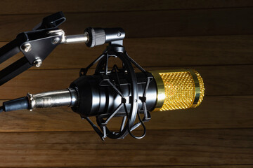 Condenser, studio microphone on a textured background.