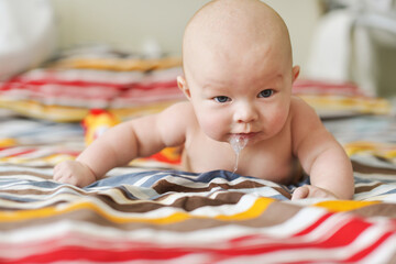 funny baby on the bed