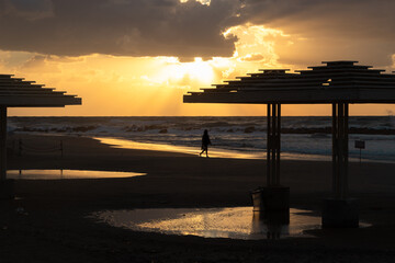 sunset on the beach with man silhouette