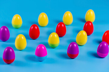 Colorful Plastic Easter Eggs on blue background