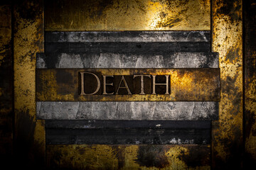 Death text on lead bar over textured grunge copper and vintage gold background