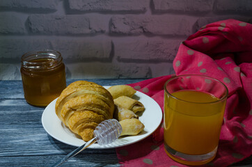 Still life with fresh fruits and glass of juice on the wooden background