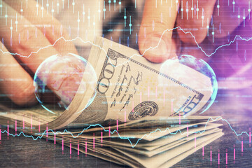 Multi exposure of forex graph drawing hologram and USA dollars bills and man hands. Technical Analysis concept.