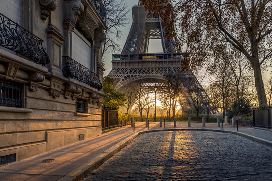 Paris, France - November 26, 2020: A back alley in Paris showcasing the architecture of the buildings with the Eiffel Tower in the background