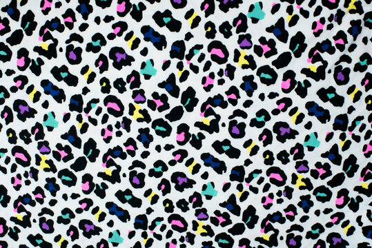 Multicolored fabric for modern youth clothing painted like dolmatian or leopard skin