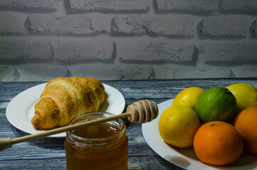 Still life with fresh fruits and glass of juice on the wooden background