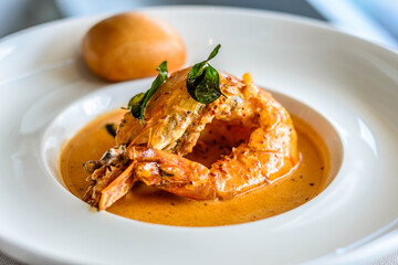 main course of King Prawn served in Bang Sauce with a bun
