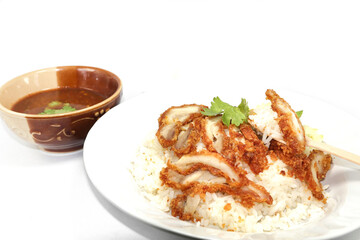 fried chicken rice set, a popular Thai dish - dipping sauce + broth - is a healthy fast food, available on the streets and at major food courts around the country, slightly spicy and delicious.