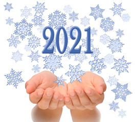 Flying snowflakes from woman’s cupped hands with 2021 text, Happy New year 2021, 2021 New Year greeting card, happiness luck health success concept, isolated on white background, 2021 greeting card co