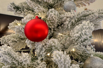 Close up of Christmas balls on a Christmas tree with white branches